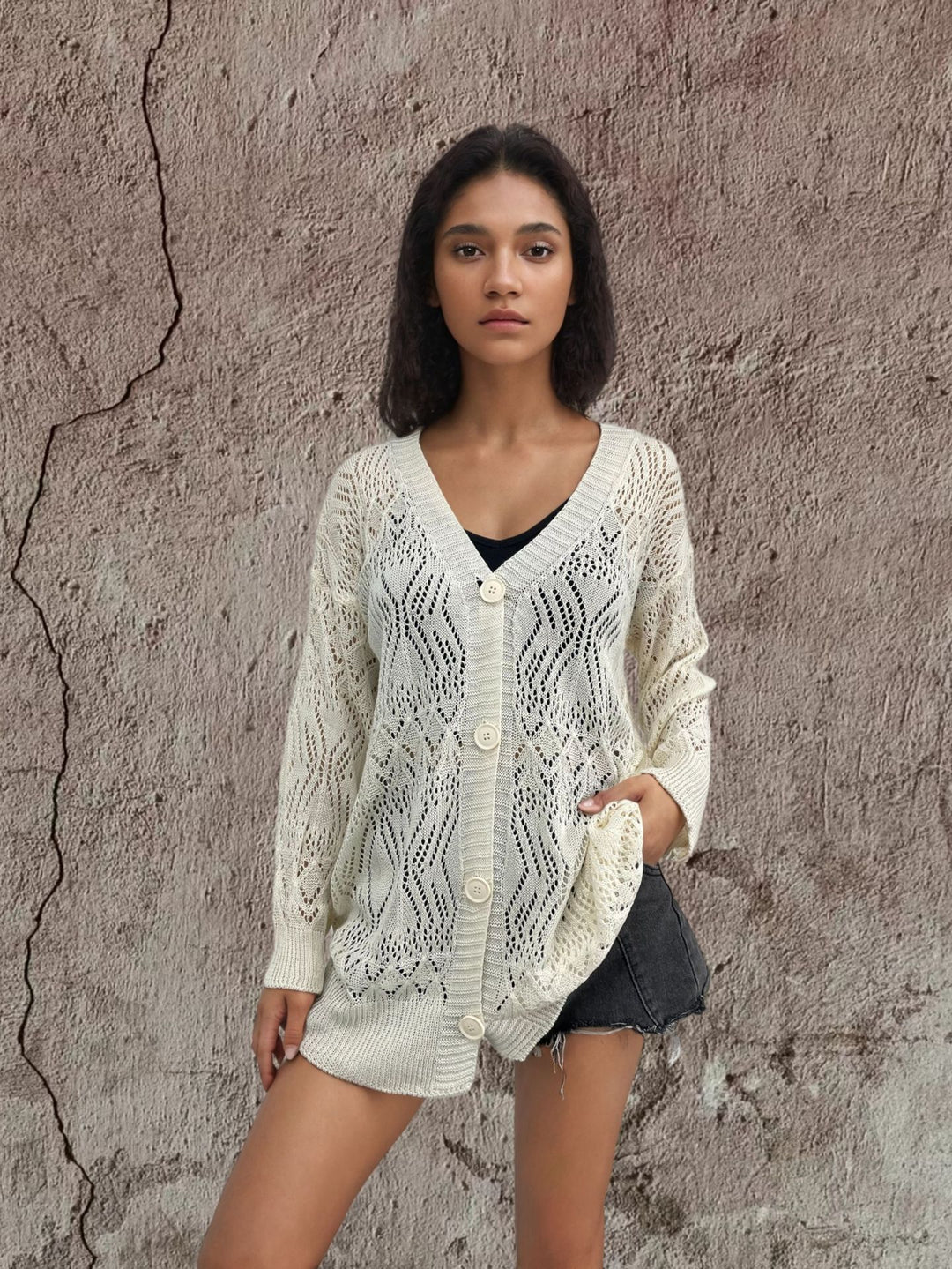 Women's knit jacket with a lovely hole pattern and elegant button details Lune London
