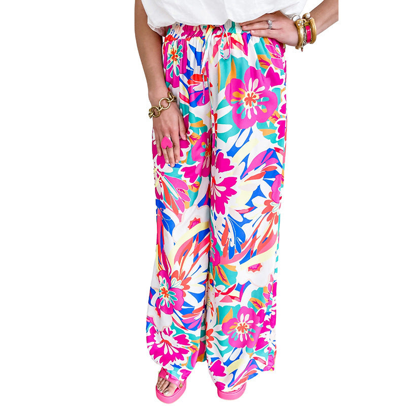 Leisure pants for women, wide, with a colorful floral pattern and an elastic waistband Lune London