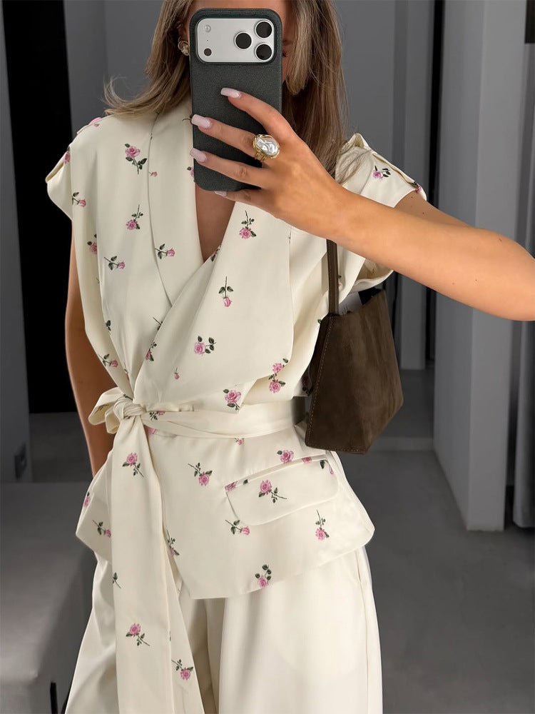 Women's sleeveless wrap blouse with fitted tie belt and patch pockets Amarae