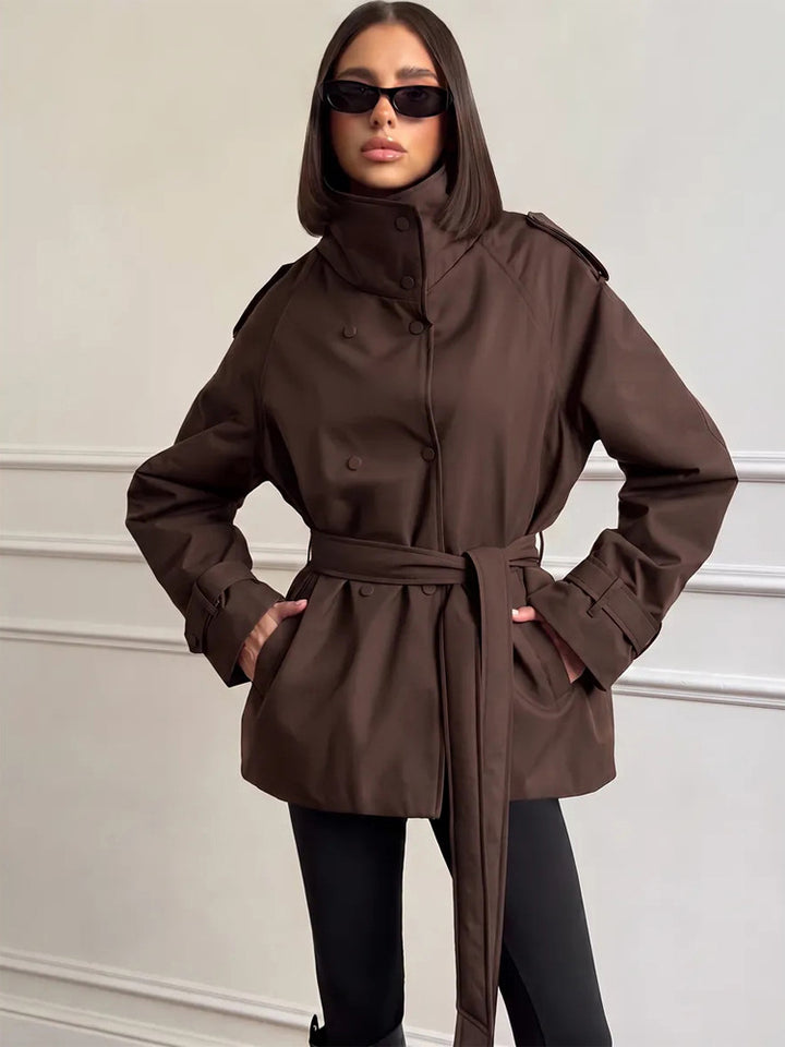 Women Short Technical Trench with High Collar Flap, Double Press Button Placket and Tailoring Tie Belt Amarae