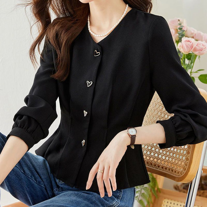 Blouse élégante pour femmes avec des détails de bouton en forme de cœur et des manches volumineuses Chic & Stil