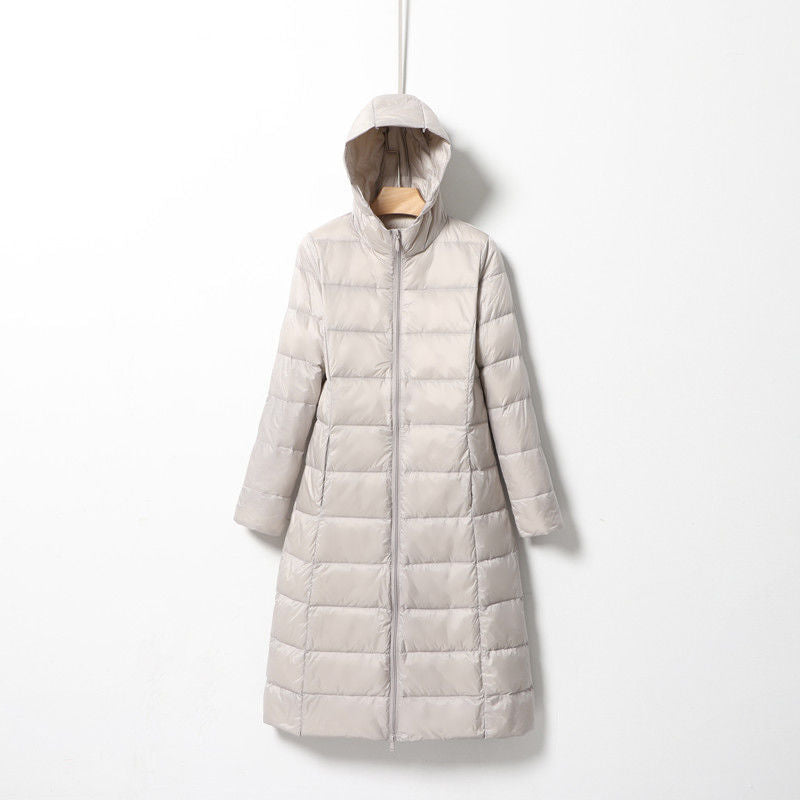 Women's longer quilted coat with hood and light thermal insulation Amarae