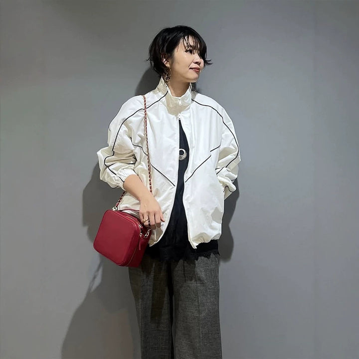 Women’s short bomber-style jacket with sculptural seam design and high stand-up collar Amarae