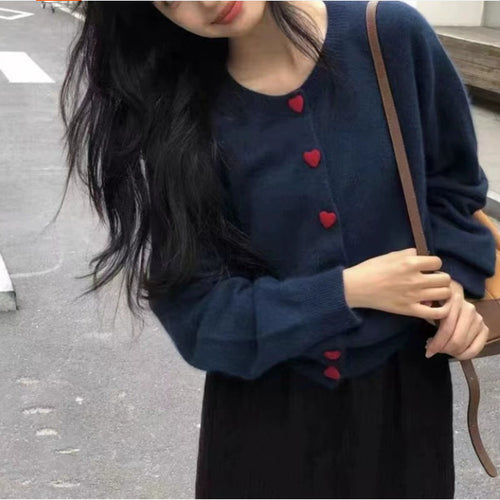 Cardigan en tricot doux pour femmes avec des boutons et une texture côtelée Chic & Stil