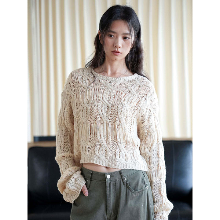 Women’s short oversized knitted sweater with openwork pattern and fringes