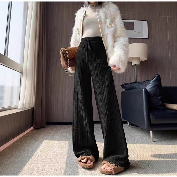 Loose linen pants for women with elastic waistband and striped design Lune London