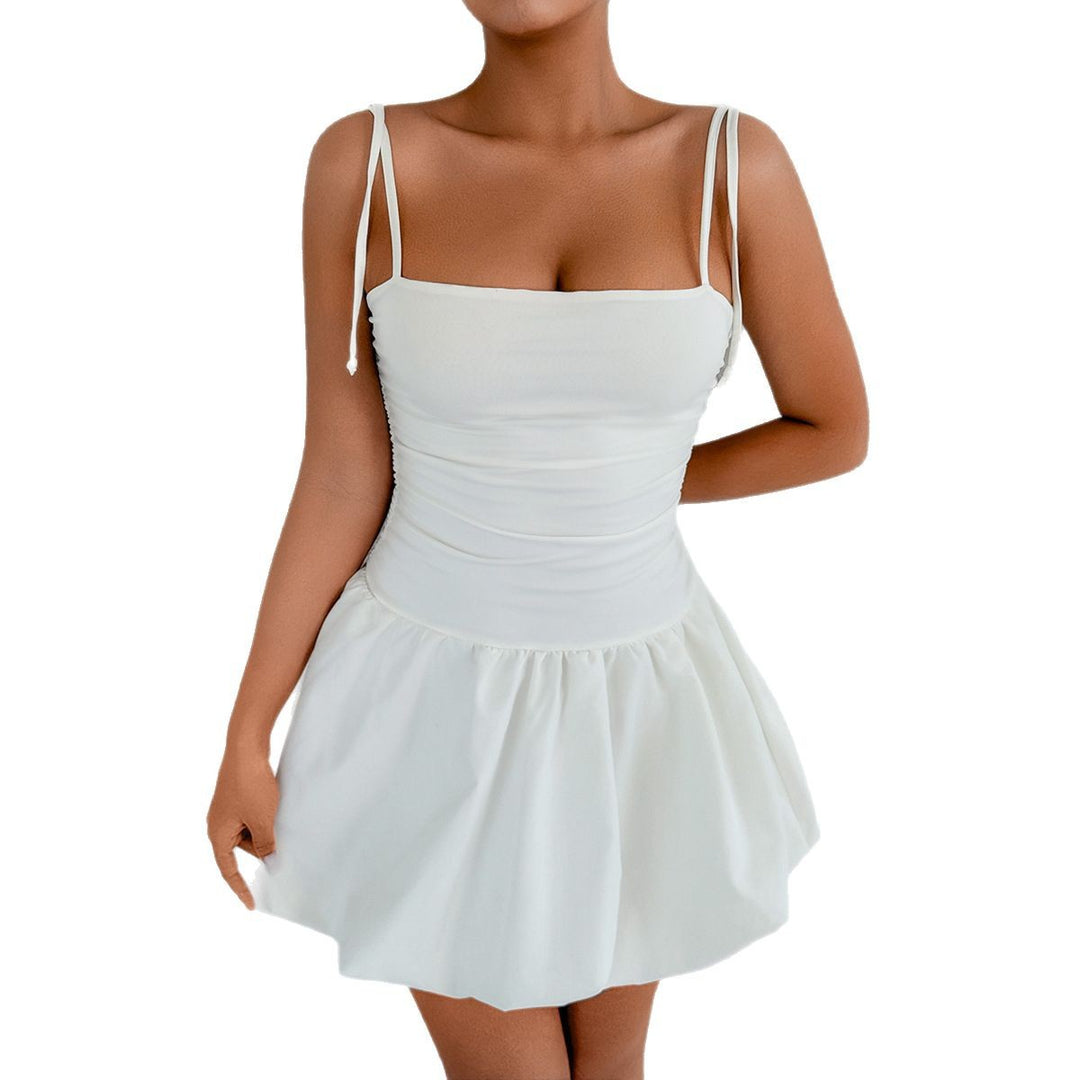 Women's playful mini dress with adjustable spaghetti straps and sophisticated ruffle hem Lune London