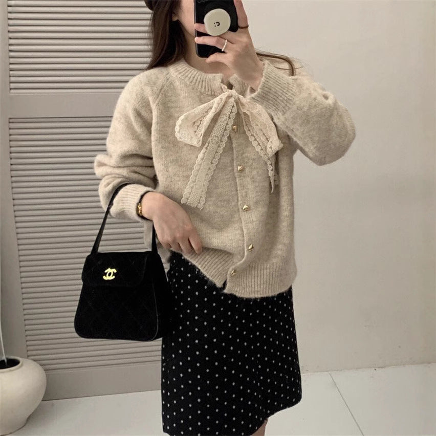 Women's knit jacket with playful lace ribbon and golden heart-shaped buttons Lune London