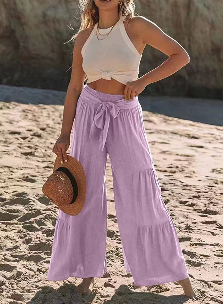 Airy palazzo pants for women with elastic waistband and practical tied belt Lune London
