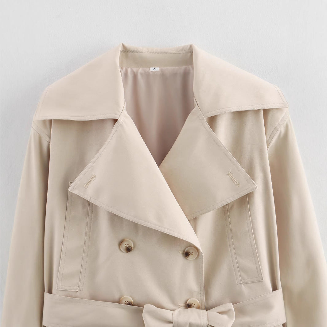 Elegant cropped trench coat for women with stylish button details and a chic belt detail