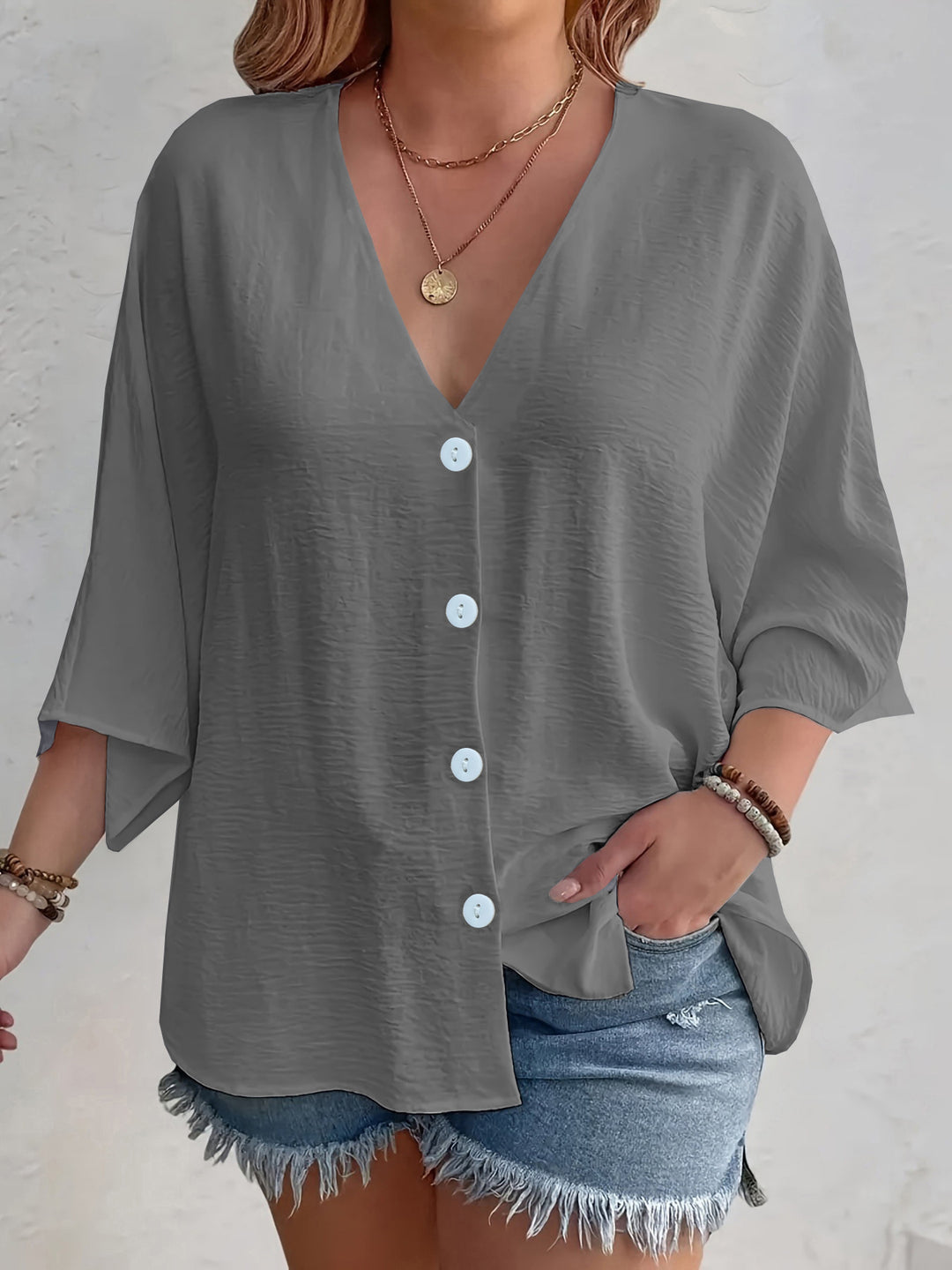 Short-sleeved advantageous blouse for ladies with button placket and V neckline Lune London