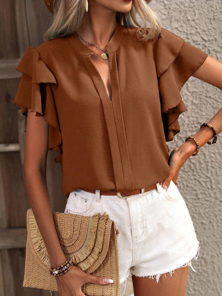 Women Elegant top with voluminous ruffled sleeves and V-neck Lune London