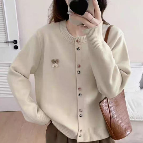 Ladies comfortable knitted cardigan with shiny buttons and decorative application Amarae