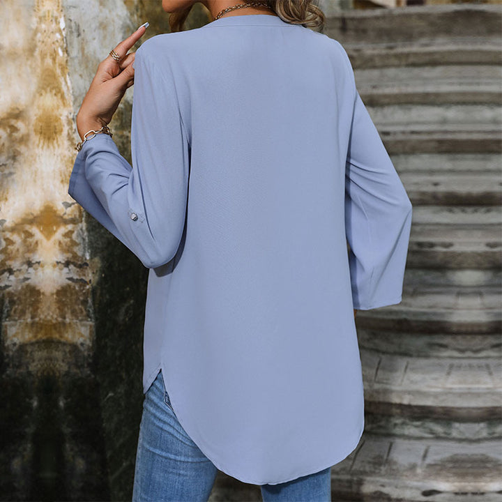 Casual blouse for ladies with trendy button details and chic ruffle hems