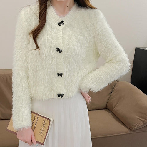 Women's cozy wool pullover with decorative bow buttons Amarae