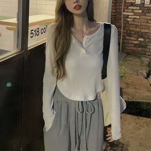 Women's long sleeve shirt with button placket and fine ribbed design