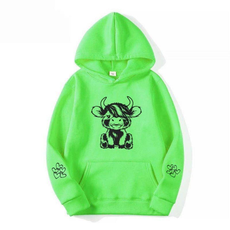 Women's hooded sweatshirt with charming cow motif and practical kangaroo pockets Lune London
