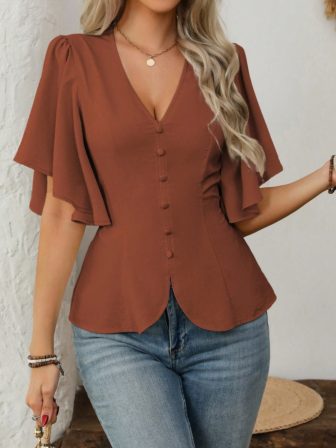 Women's elegant blouse with bell sleeves and button detail Lune London