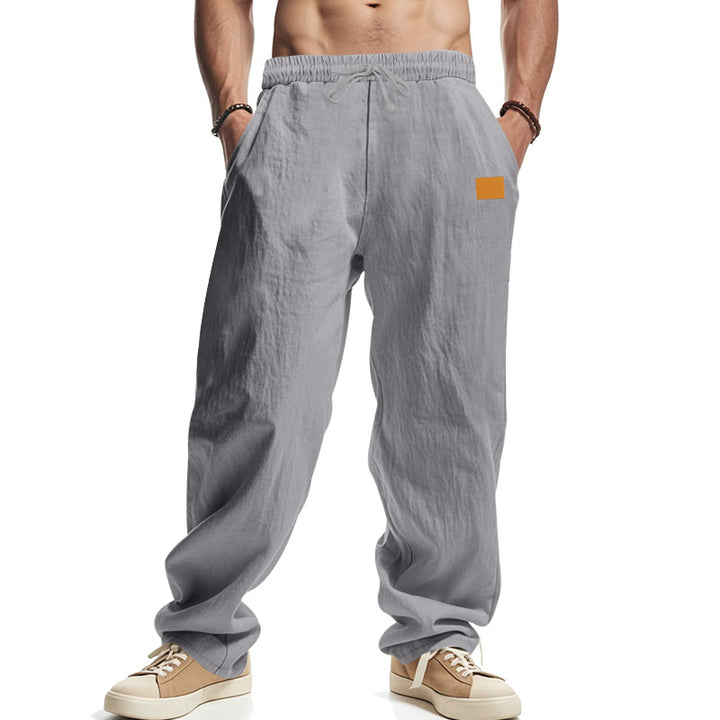 Linen pants for men with a relaxed fit featuring an adjustable drawstring and practical side pockets Lune London