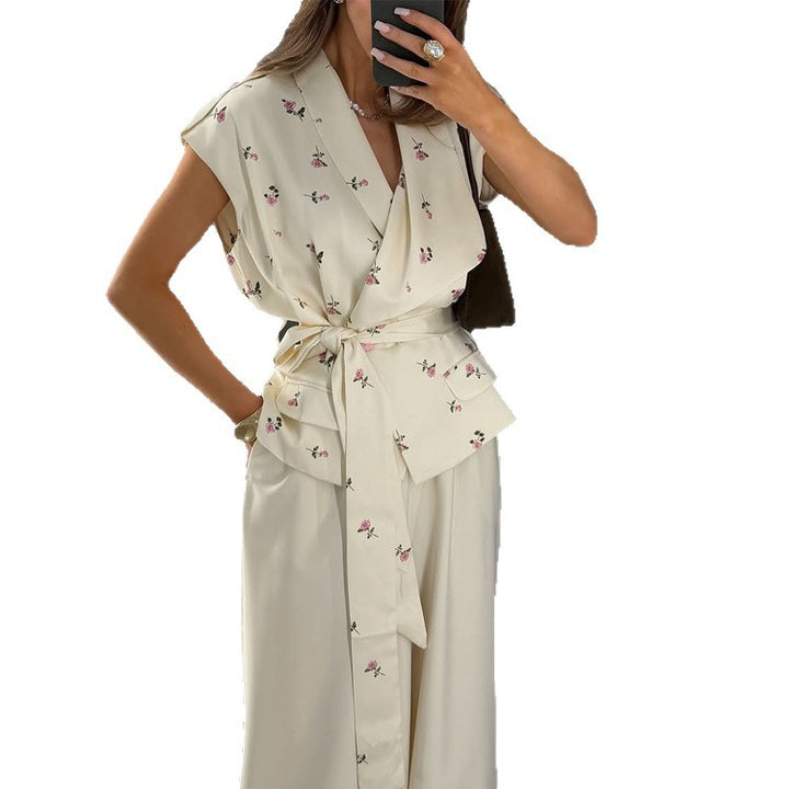 Women's sleeveless wrap blouse with fitted tie belt and patch pockets Amarae