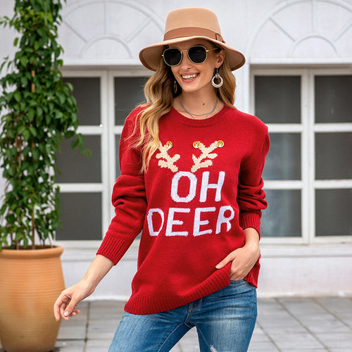 Knitted sweater for ladies with festive reindeer pattern and gold buttons Amarae