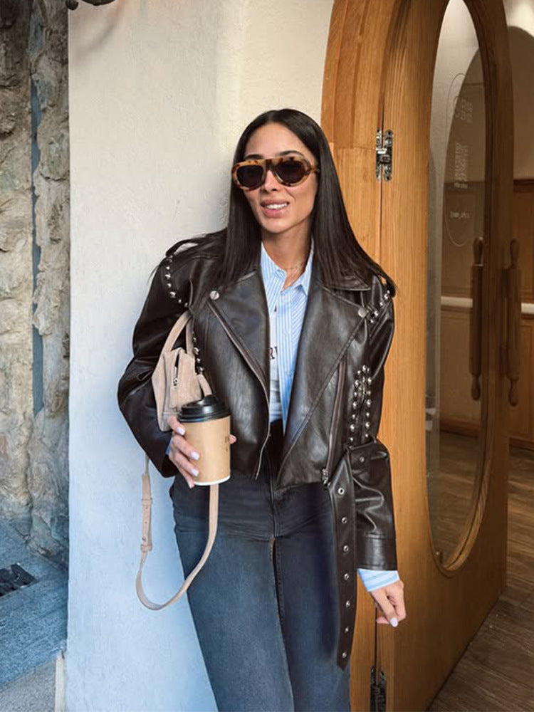 Women's Short Studded Biker Jacket Made of Faux Leather with Waist Belt Amarae