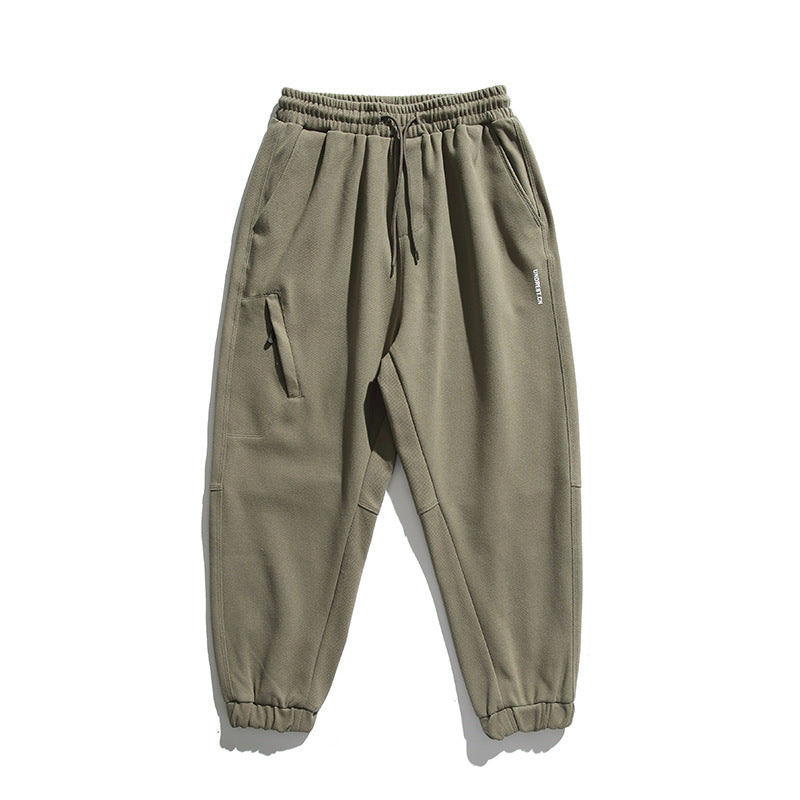 Unisex wide jogging pants in oversized cut with elastic waistband, knee panel and ribbed cuffs Amarae