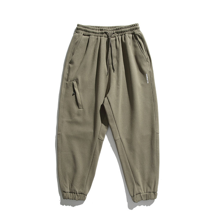 Unisex wide jogging pants in oversized cut with elastic waistband, knee panel and ribbed cuffs Amarae