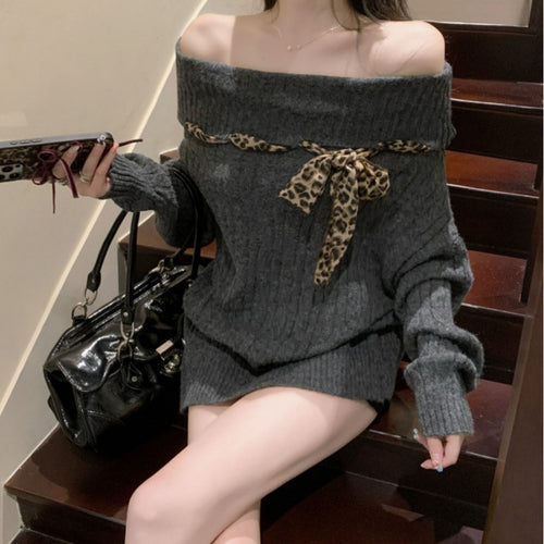 Chunky knit sweater for women with off-the-shoulder design and playful bow accent Amarae