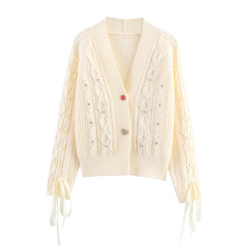Knitted jacket for women with a detailed textured pattern and elegant ruffle details Lune London