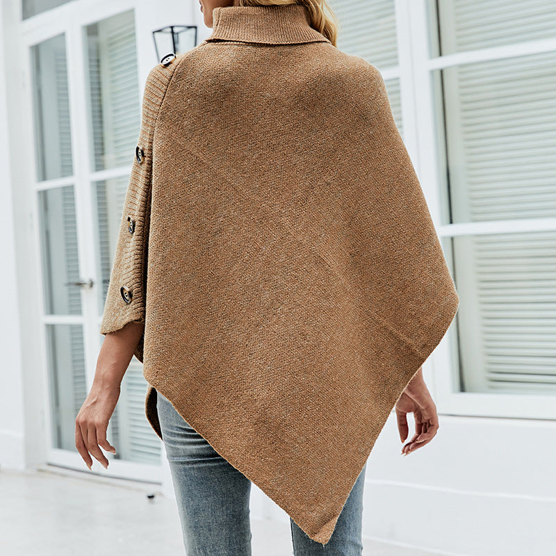 Lady knit poncho with high collar and decorative buttons Lune London