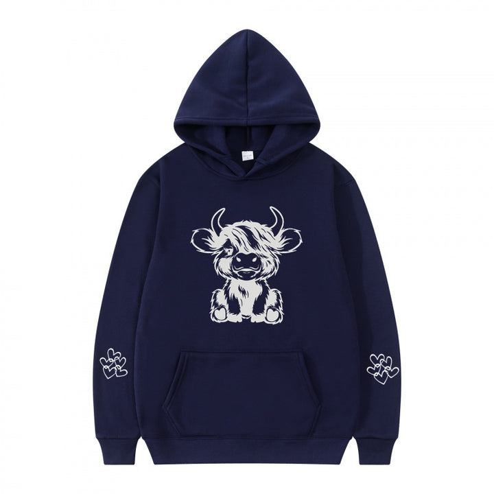 Women's hooded sweatshirt with charming cow motif and practical kangaroo pockets Lune London