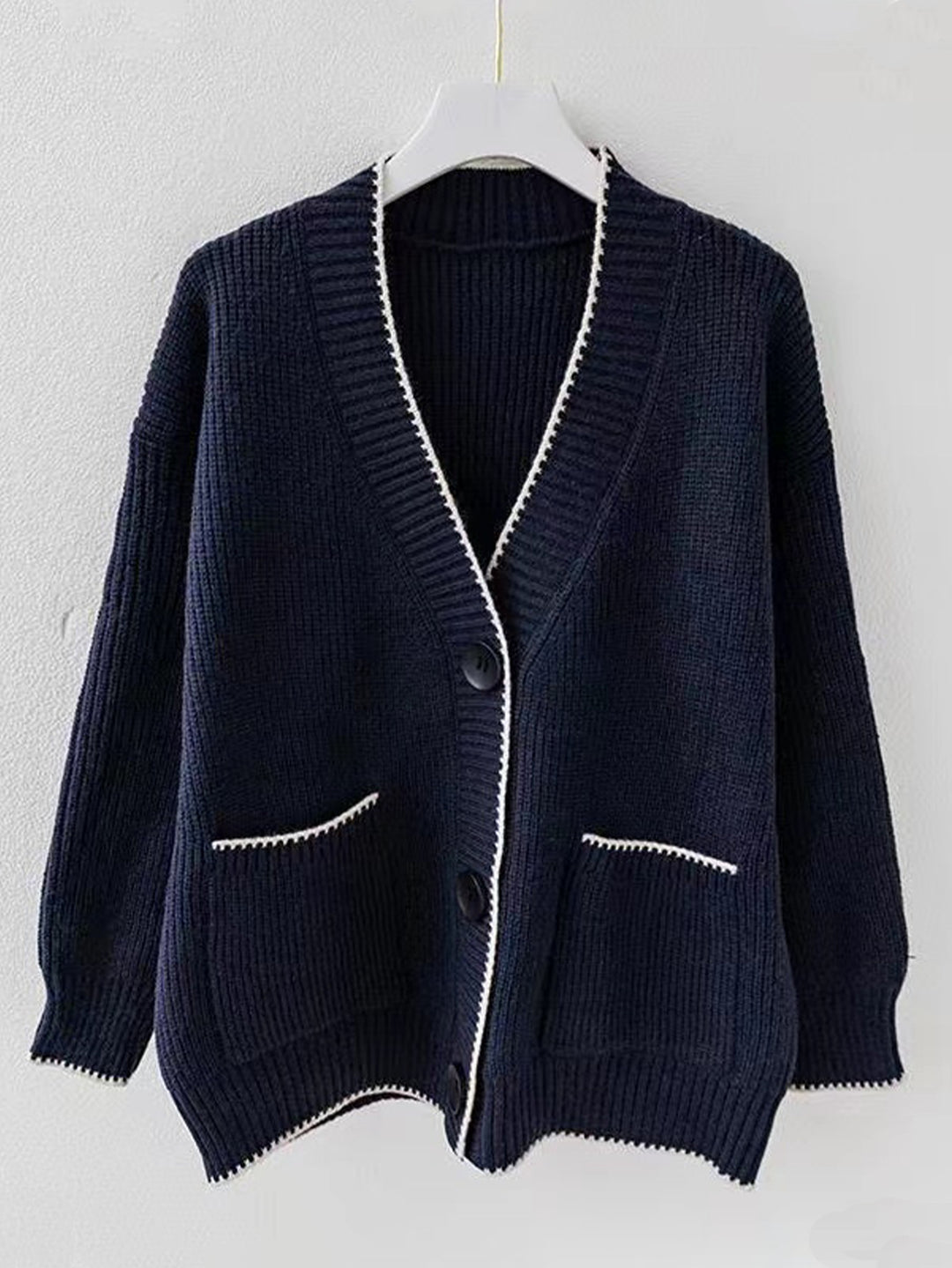 Ladies thick knit cardigan with deep V-neck and practical pockets Lune London