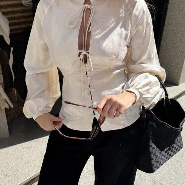 Women Jacquard Satin Blouse with Stand-up Collar, Ties and Fitted Peplum Amarae