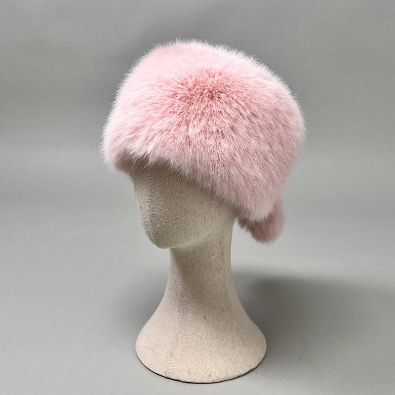 Women’s plush faux fur trapper hat with earflaps and decorative tail Amarae
