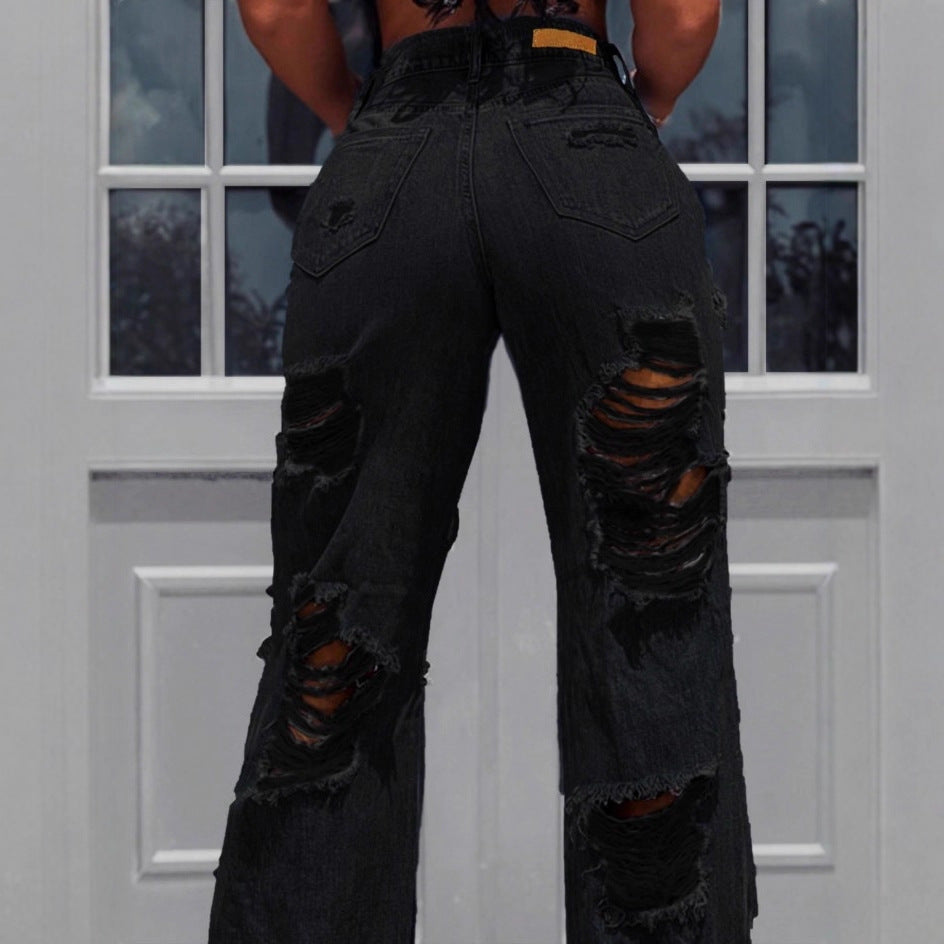 Ladies high-waisted destroyed jeans with wide legs and large knee rips Amarae