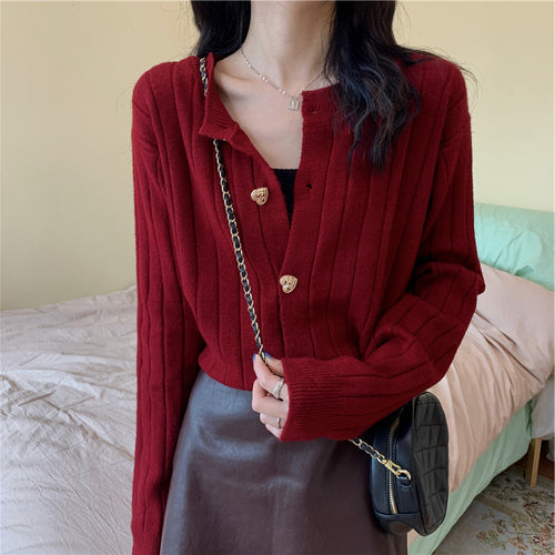 Women's knit jacket with a decorative button design and a vertical ribbed pattern Amarae