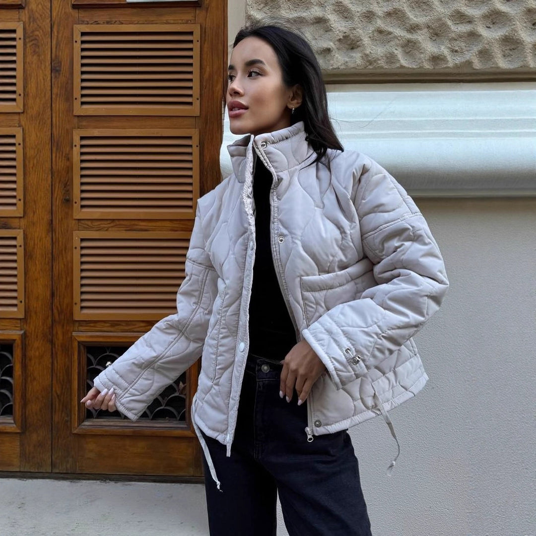 Quilted transitional jacket for women with high collar and drawstring Lune London
