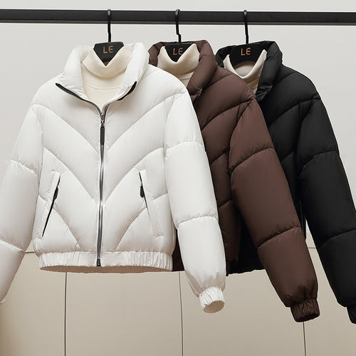 Trendy and comfortable women's puffer jacket with high collar and practical piped pockets Amarae