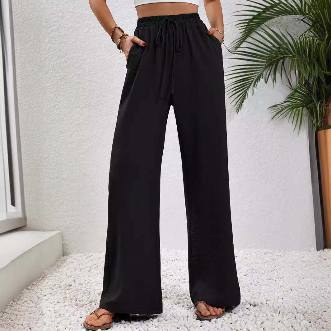 Pantalons larges d'été pour femmes avec taille élastique et poches latérales pratiques Chic & Stil
