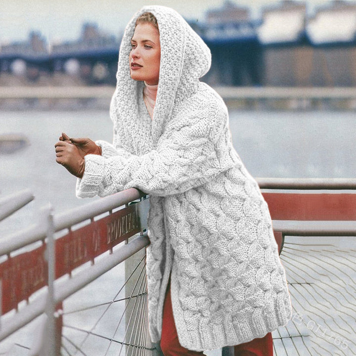 Thick knitted coat for women with hood and decorative cable knit pattern Lune London