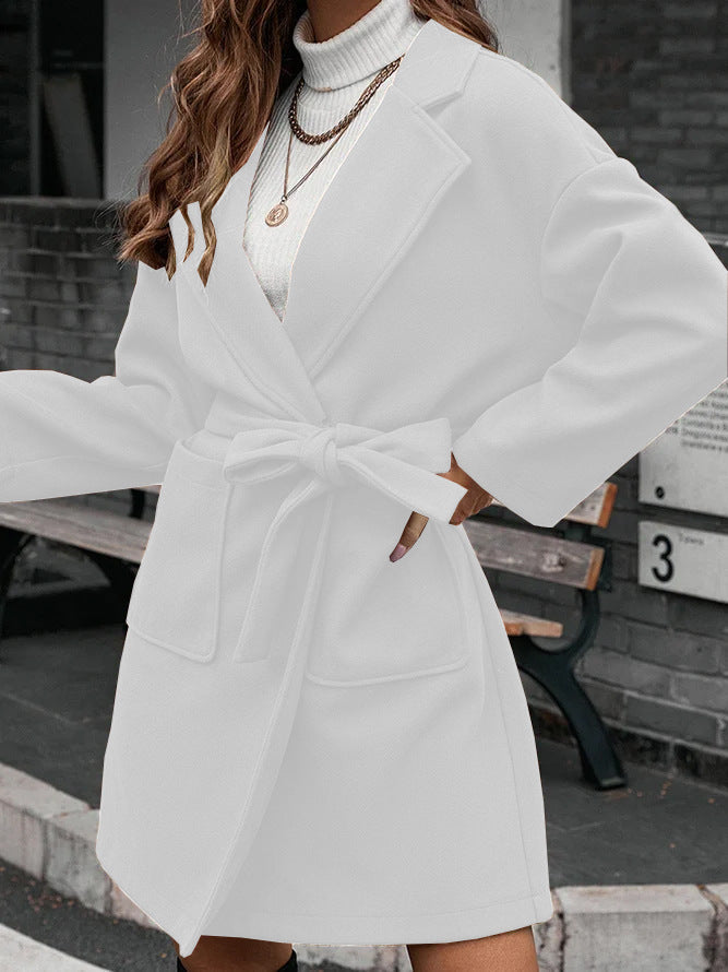 Ladies wrap coat with tie belt, large flap pocket and lapel collar Amarae