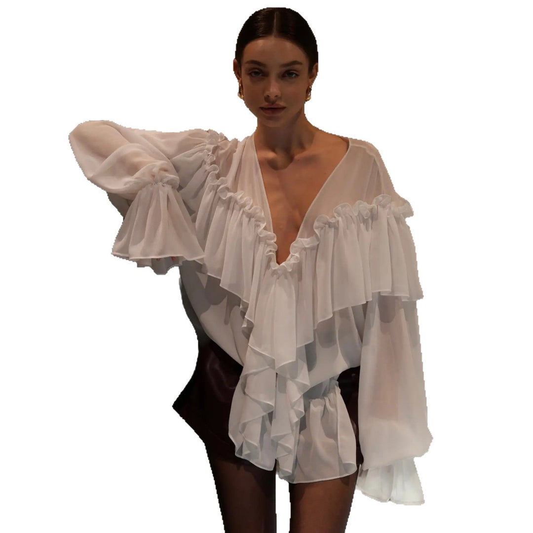 Blouse for women with voluminous ruffle details and an elegant button placket Lune London