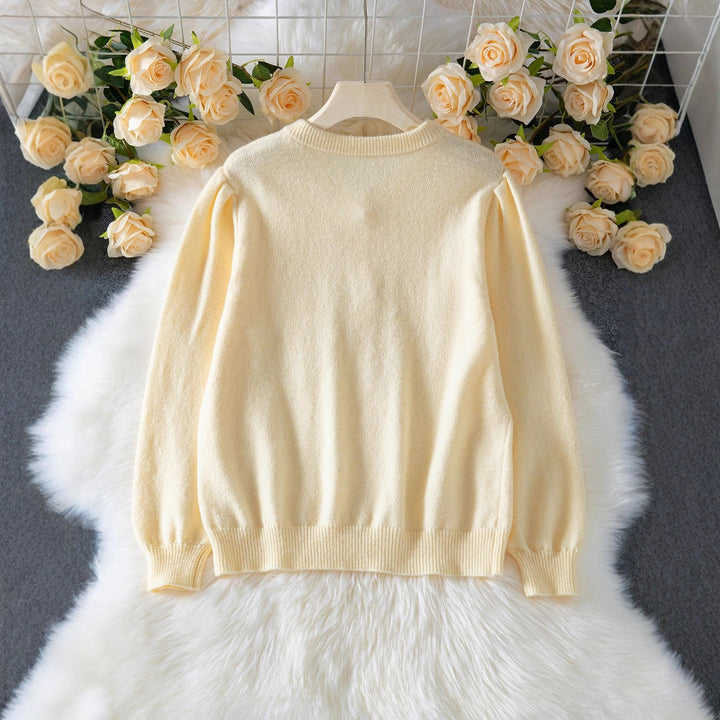 Elegant knitted jacket for women with fine diamond patterns and mother-of-pearl buttons Lune London
