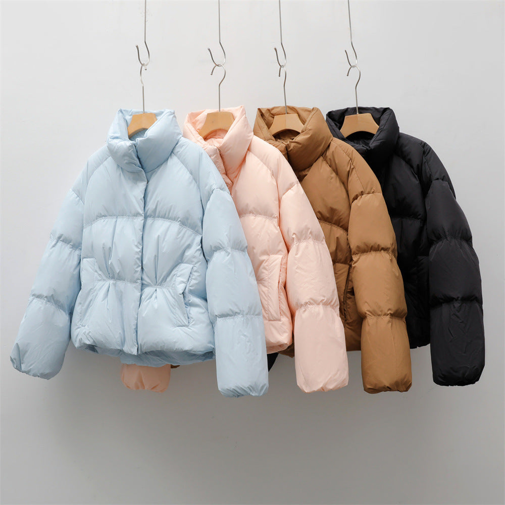 Short quilted jacket with high collar for women with practical pockets Lune London