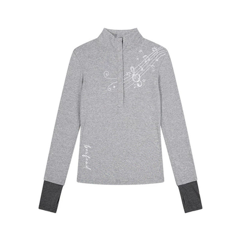 Women’s long-sleeve shirt with Henley button placket, contrast cuffs, and music note print Amarae