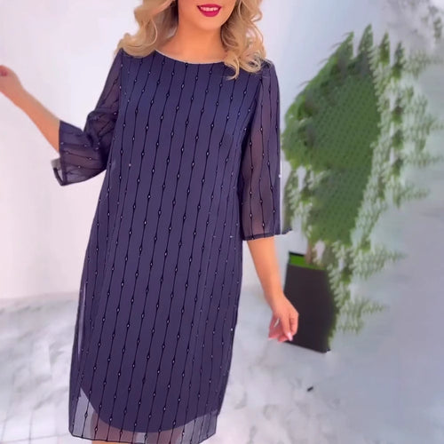 Robe de gala pour femmes avec des manches transparentes et des détails perles subtils Chic & Stil
