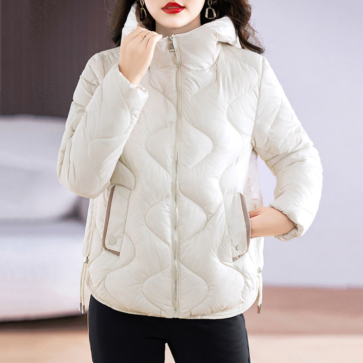 Insulated quilted jacket for women with high collar and practical zip pockets Lune London