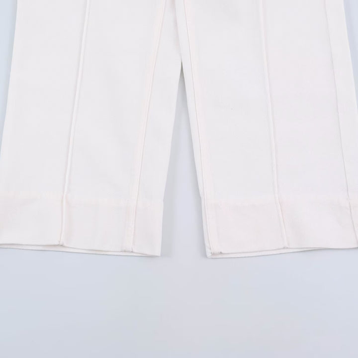 Ladies' wide jeans with a high waist, pressed crease, and patch pockets.