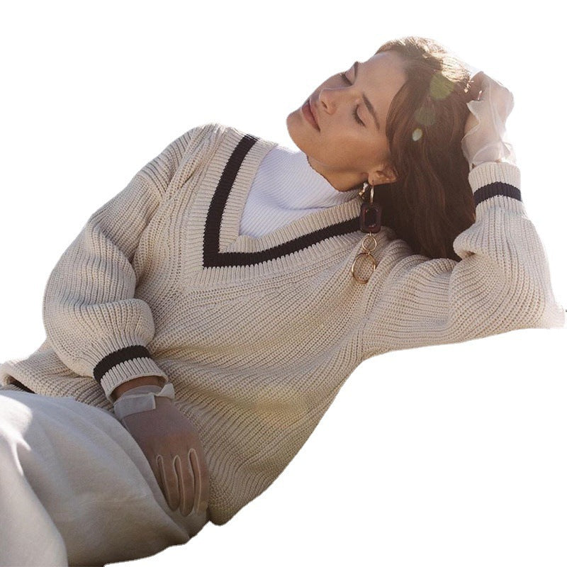 Trendy women's sweater with V-neck, puff sleeves, and textured fabric Lune London
